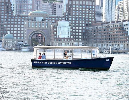 A blue water taxi labeled 